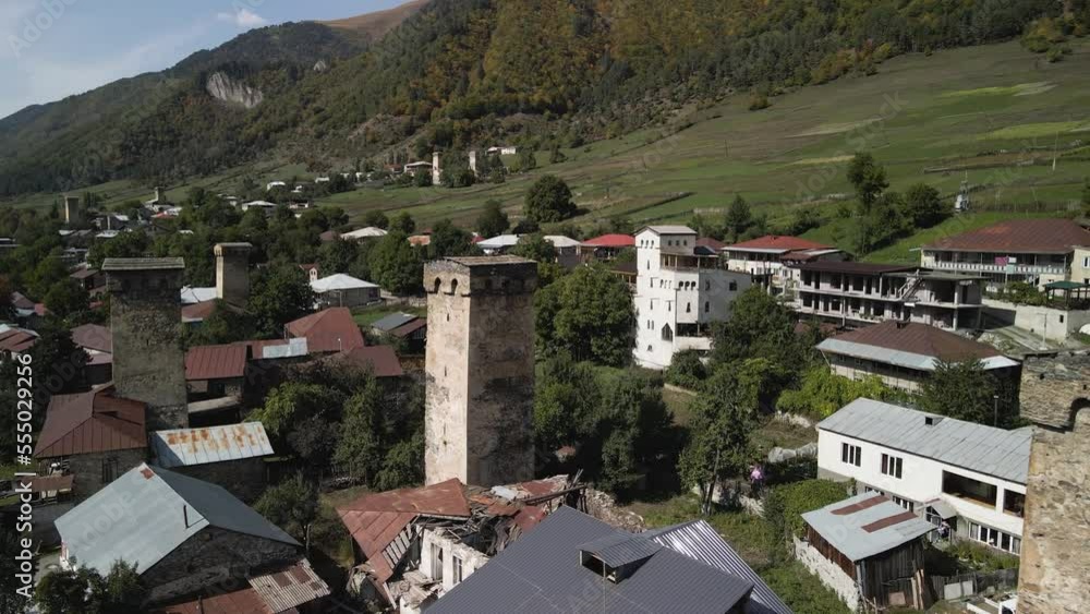 Drone view of residential and Caucasus mountain in background, Svaneti, Georgia Drone view of residential and Caucasus mountain in background, Svaneti, Georgia