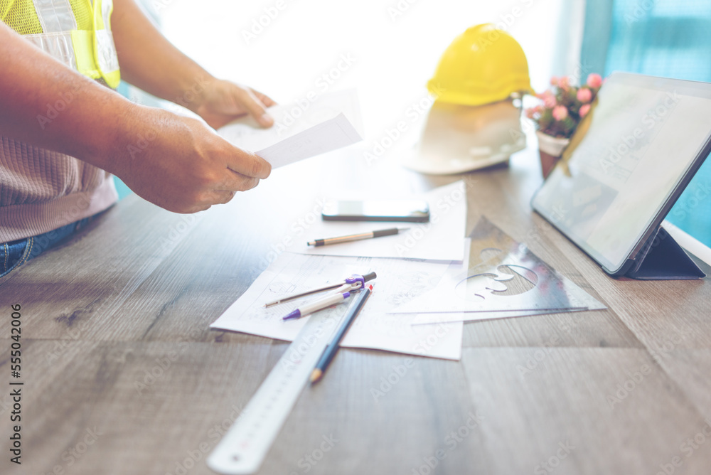 mechanical engineer Drafting a machine in the workshop