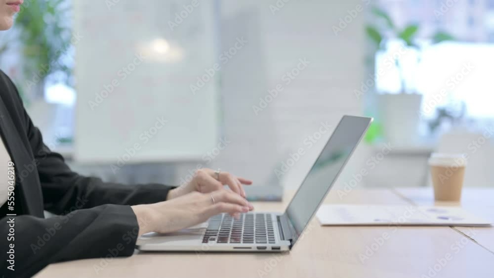 Side View of Businesswoman Typing on Laptop Side View of Businesswoman Typing on Laptop