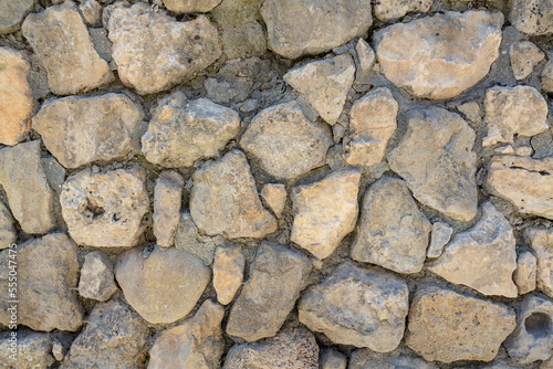  Ancient medieval stonework. The texture of a fragment of the wall of an old building. Background for design and creativity... 