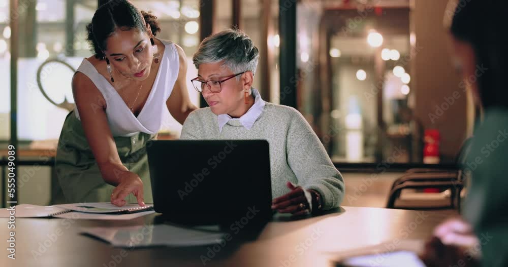 Woman, laptop and document collaboration at night in business office for marketing report deadline, working overtime or meeting planning. Corporate females, teamwork and strategy research in evening Woman, laptop and document collaboration at night in business office for marketing report deadline, working overtime or meeting planning. Corporate females, teamwork and strategy research in evening