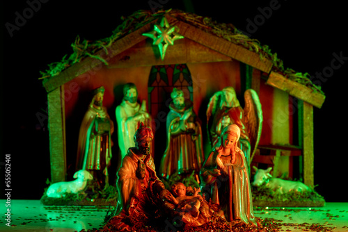Nativity scene with figures. Christmas Manger scene with figures of Jesus, Mary, Joseph, sheep and magi. Statuettes of the Nativity.