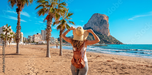 Woman tourist on the tropical beach,  Calpe,  Alicante province in Spain, costa blanca