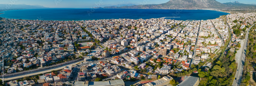 Aerial view around the city Corinth in Greece on a late sunny afternoon.