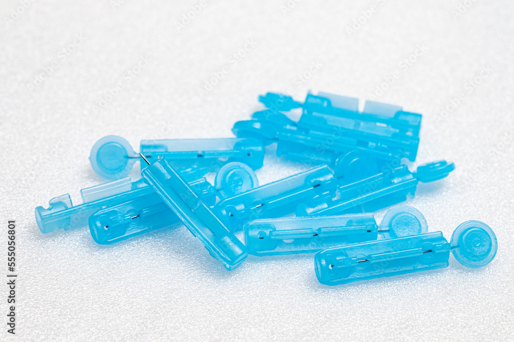 Lancets for pen on white background. Diabetes concept Lancets for pen on white background. Diabetes concept