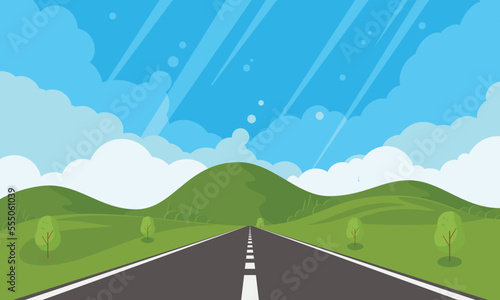 Road through fields and hills. Straight empty asphalt highway. Asphalt highway with markings in the countryside.