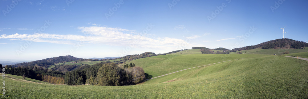 Panoramic view of landscapes around Gersbach in Black Forest. Wind turbines on top of green hills surrounded by dense forests