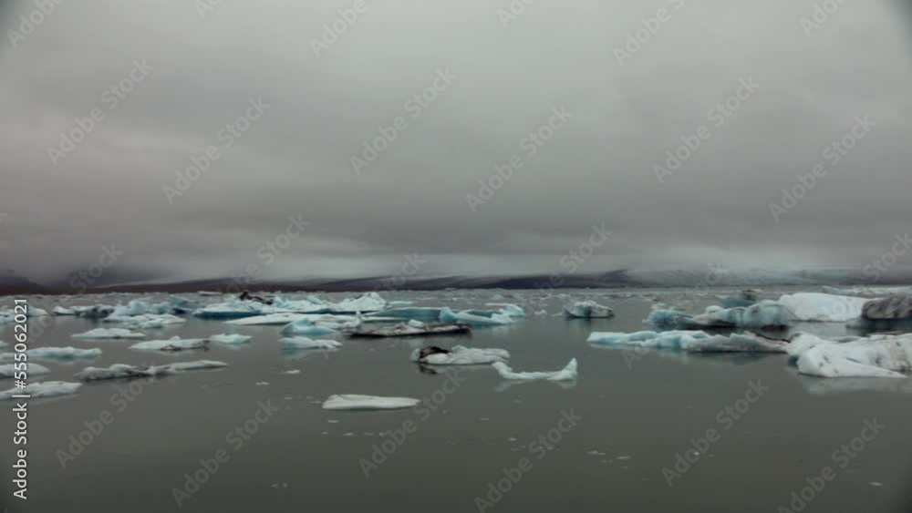 Melting ice and icebergs in glacial lake in Iceland. Global warming footage Melting ice and icebergs in glacial lake in Iceland. Global warming footage
