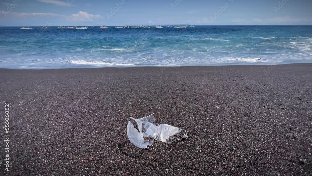 Waves On The Sandy Shore With Plastic Garbage In Bali, Indonesia. Close Up Waves On The Sandy Shore With Plastic Garbage In Bali, Indonesia. Close Up