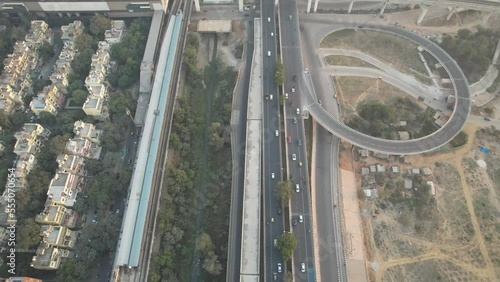 Aerial Drone Footage of Delhi Metro Train Station  Mayur Vihar Intersection highway with traffic Indian Flag  photo