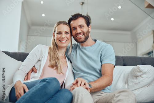 Love, relax and portrait of couple on sofa enjoying quality time together on weekend, vacation and holiday. Relationship, happiness and man and woman smile for romance, affection and embrace at home