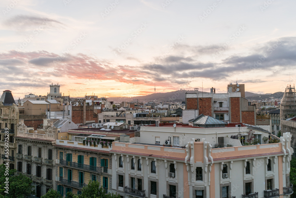 Shot of high spanish buildings in Barcelona with amazing sunset.