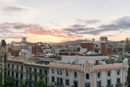 Shot of high spanish buildings in Barcelona with amazing sunset.