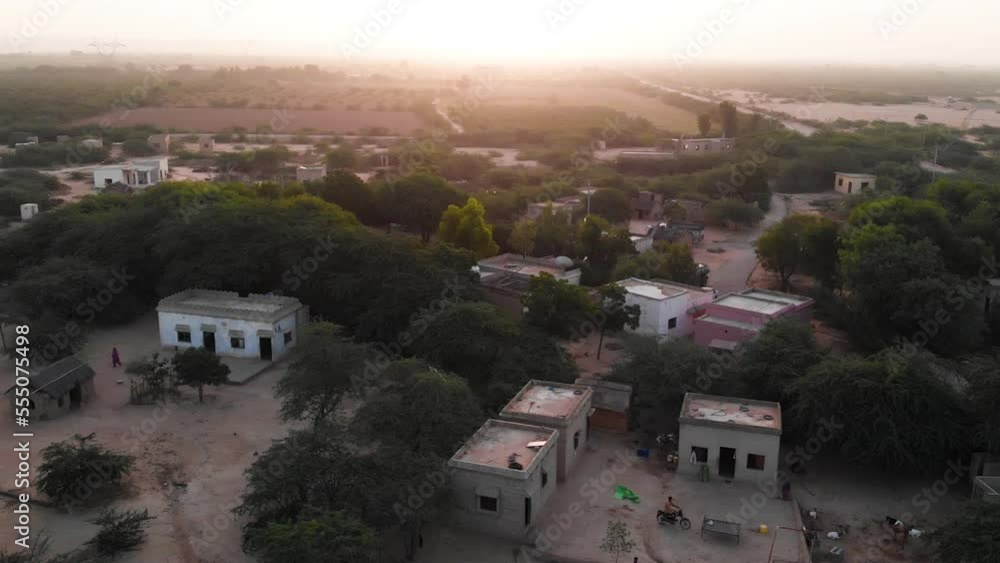 Aerial Parallax Shot View Of Rural Village In Sindh With Sunset On Horizon Aerial Parallax Shot View Of Rural Village In Sindh With Sunset On Horizon