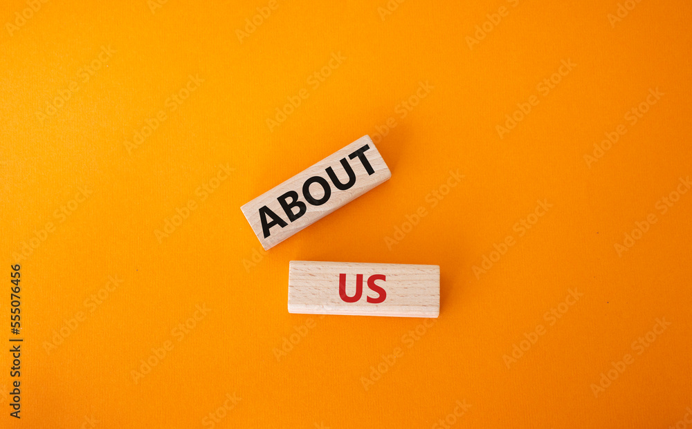 About us symbol. Wooden blocks with words About us. Beautiful orange background. Business and About us concept. Copy space. About us symbol. Wooden blocks with words About us. Beautiful orange background. Business and About us concept. Copy space.