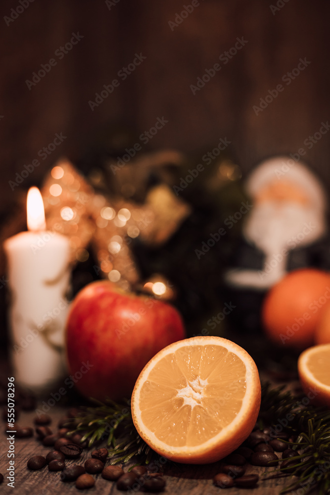 Christmas composition coffee beans, orange, wine, candle. New Year's table