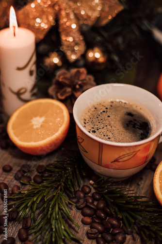 Christmas composition coffee beans, orange, wine, candle. New Year's table