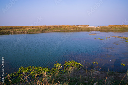 Crystal clear blue water lake landscape view nearby Padma river in Bangladesh