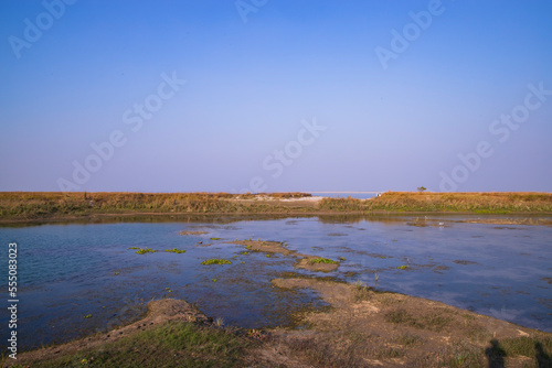 Crystal clear blue water lake landscape view nearby Padma river in Bangladesh