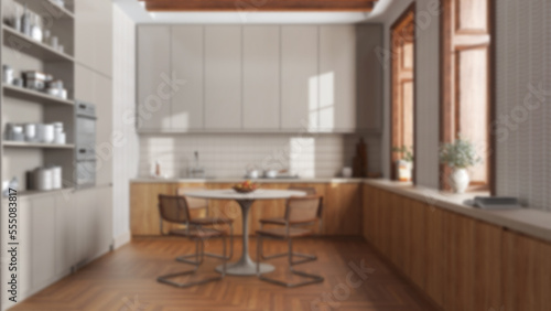 Blurred background, modern trendy kitchen and dining room. Wooden cabinets and big window. Minimalist farmhouse interior design © ArchiVIZ