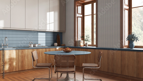 Japandi trendy kitchen and dining room in white and blue tones. Wooden cabinets, contemporary wallpaper and window. Minimalist interior design