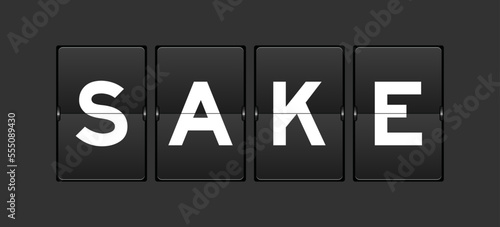 Black color analog flip board with word sake on gray background