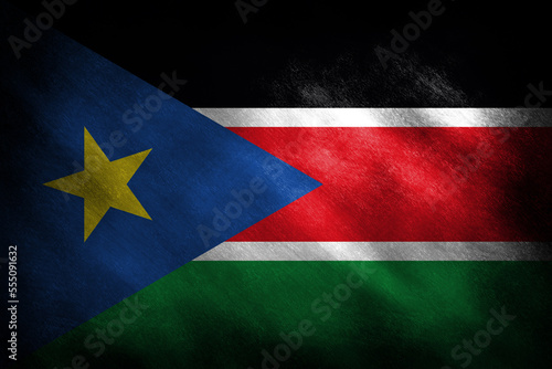 The flag of South Sudan on a retro background