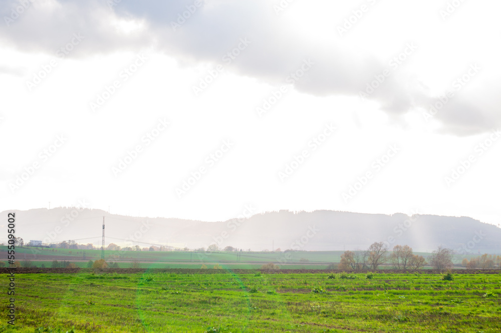 beautiful calm landscape. overlooking hills fields and forests under a cloudy sky