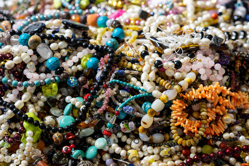 many gemstone chains at a market