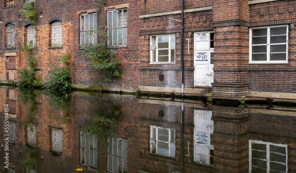 Fototapeta premium Dilapidated canalside industrial building in Birmingham