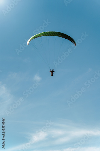 Amazing view of paragliding on the sky with epic sunlight
