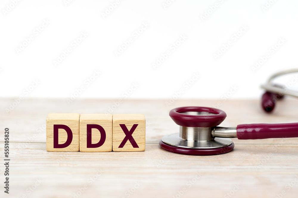 Word DDX (Differential diagnosis ) on wooden blocks and stethoscope on white background. Medical, health care. Health insurance. clinic and medical busines.   - obrazy, fototapety, plakaty 