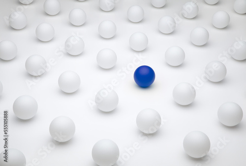 Pattern of white round ping pong balls on a white background with a colourful ball, representing dissimilarity, imaginative and creative thinking, innovation, extraordinary, or purity and freshness photo