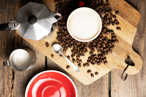 a cup coffee and moka with milk jug