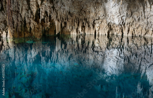 Cenote cave lake  Chichen Itza  Mexico. Cenote Zapote. Natural sinkhole pond with crystal clear water.