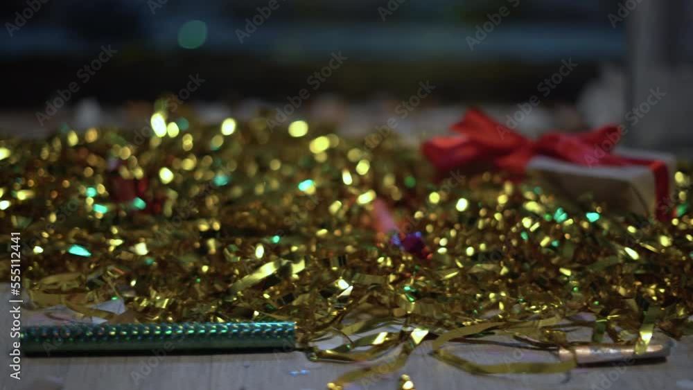 Floor with after a party celebration with empty bottles, gift box and party decorations, gold foil strip, messy living room interior, After party chaos, birthday Floor with after a party celebration with empty bottles, gift box and party decorations, gold foil strip, messy living room interior, After party chaos, birthday