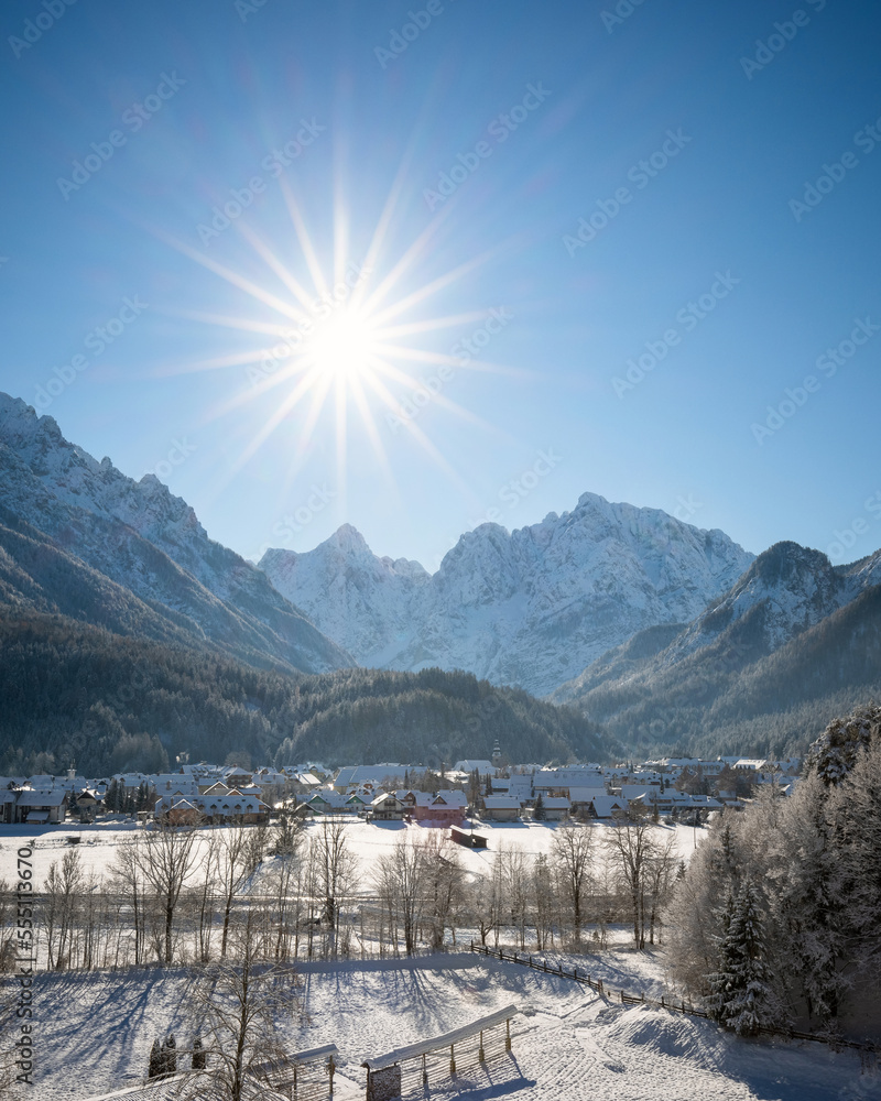 Kranjska Gora in Slovenia covered in snow at winter with Julian Alps and Triglav National Park in the background