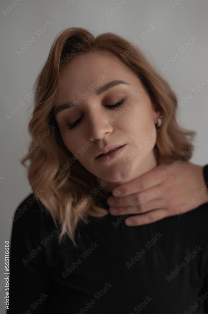Sexy confident woman studio portrait wearing black lingerie isolated against dark background. Sexy confident woman studio portrait wearing black lingerie isolated against dark background.