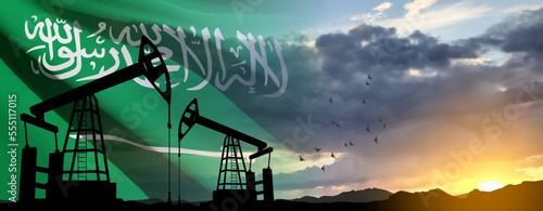 Silhouette of Oil pump on background of flag of Saudi Arabia against the sunset or sunrise. Saudi Arabia Oil industry concept. EPS10 vector