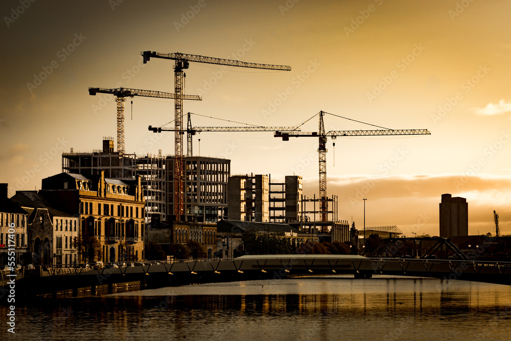 A spectacular sunset view over Cork City Ireland with buildings in construction