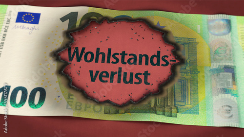 Wohlstandsverlust - Brandloch in 100 Euro Schein photo