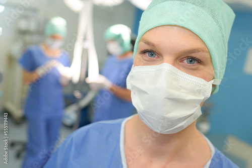 portrait of female surgeon wearing surgical mask in hospital