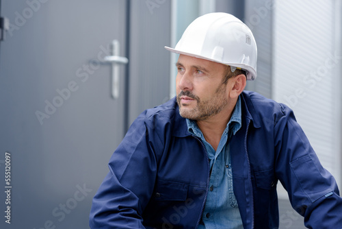 a male builder is outdoors
