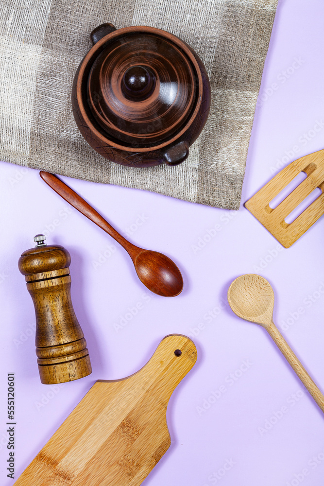 Natural beige and brown wooden dishes and a baking pot