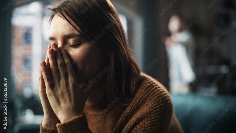 Portrait of Sad Crying Woman being Harrased and Bullied by Her Partner. Couple Arguing and Fighting Violently. Domestic Violence and Emotional Abuse. Rack Focus with Boyfriend Screaming in Background - obrazy, fototapety, plakaty 
