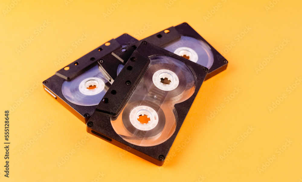 Fototapeta premium Three audio cassettes on an orange background