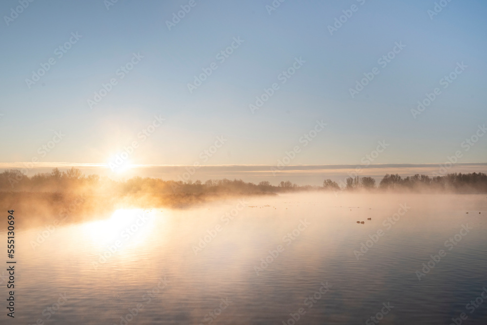Beautiful winter morning, sunrise on lake the Netherlands.