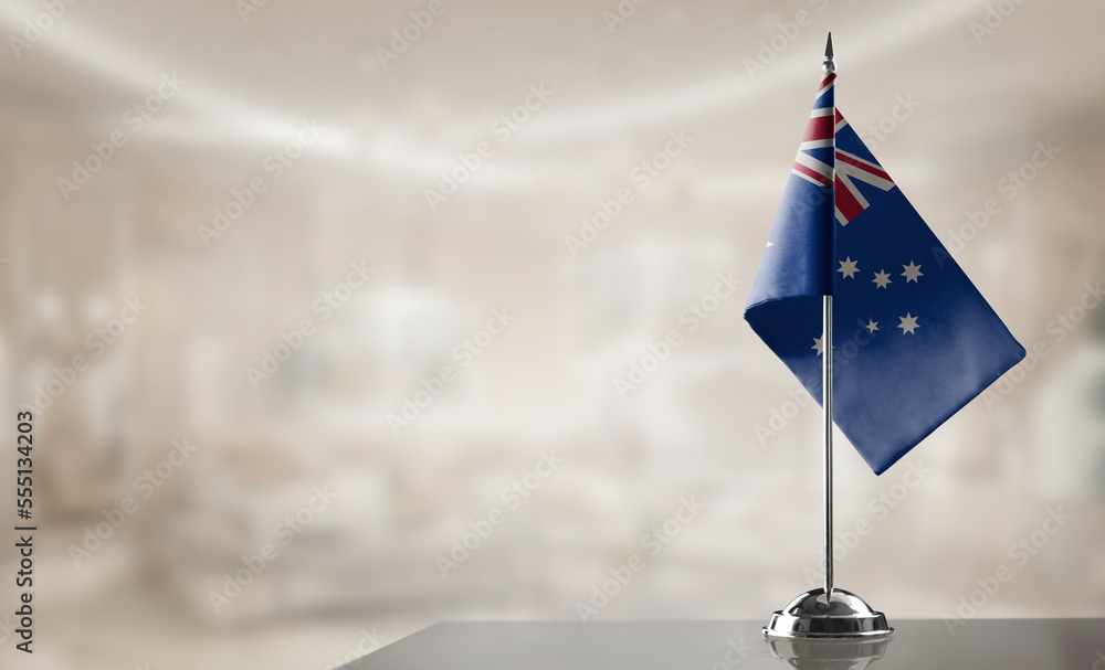 Fototapeta premium A small Australia flag on an abstract blurry background