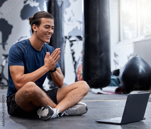 Fitness gym, laptop and video call, influencer and live streaming for social media, exercise and training. Happy smile, young male talking and communicating on video conference or webinar for workout