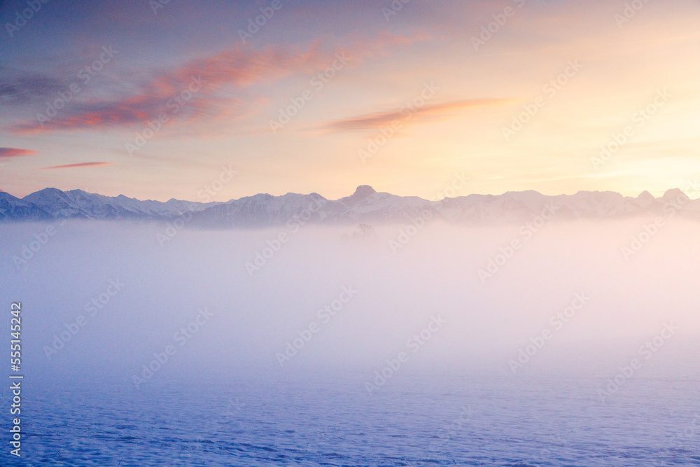 misty sunset with Stockhorn ridge in the distance